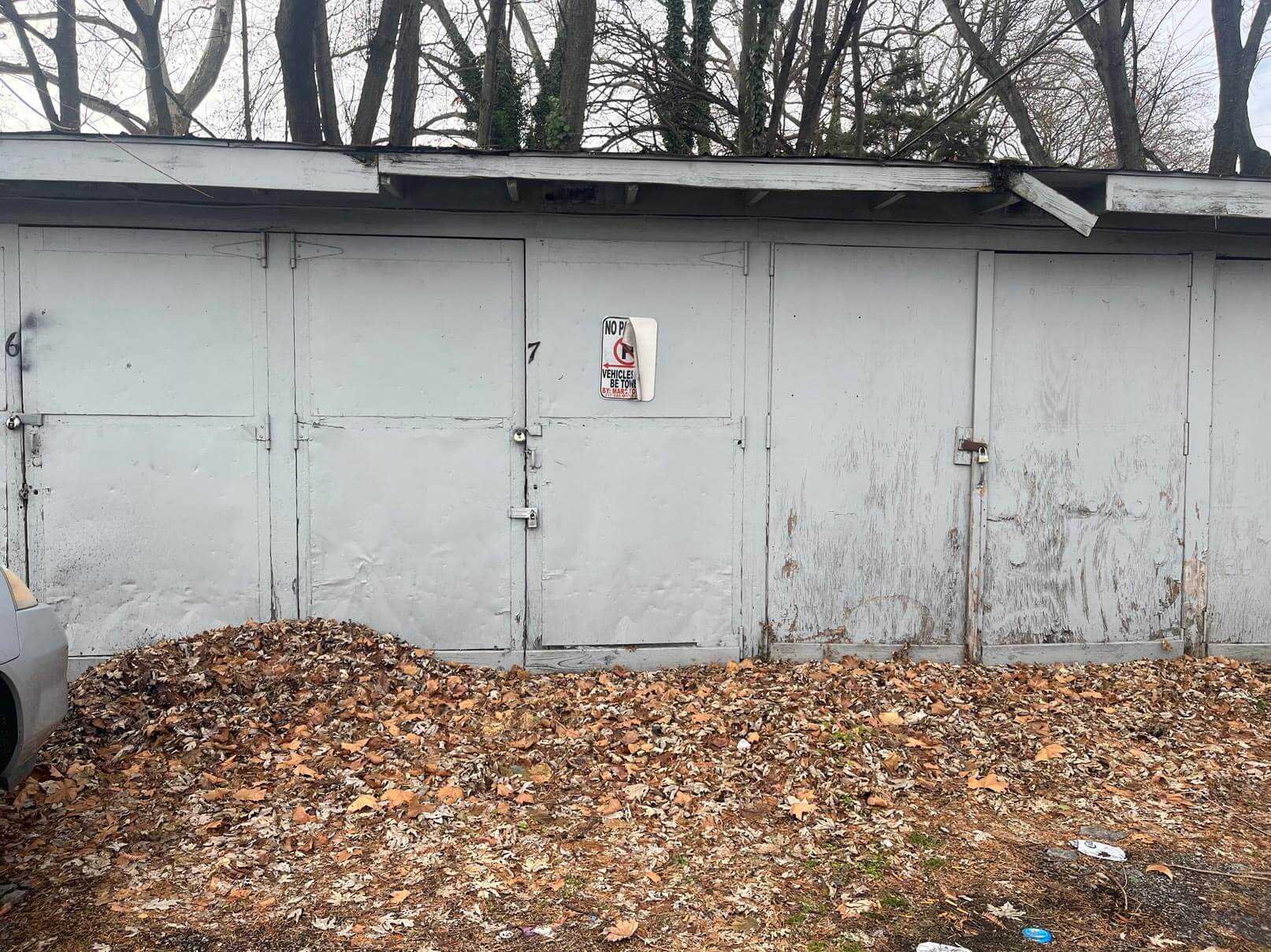 Wide-angle shot of multiple garage bays on a commercial property, illustrating We Buy Garages’ latest investment in Central PA